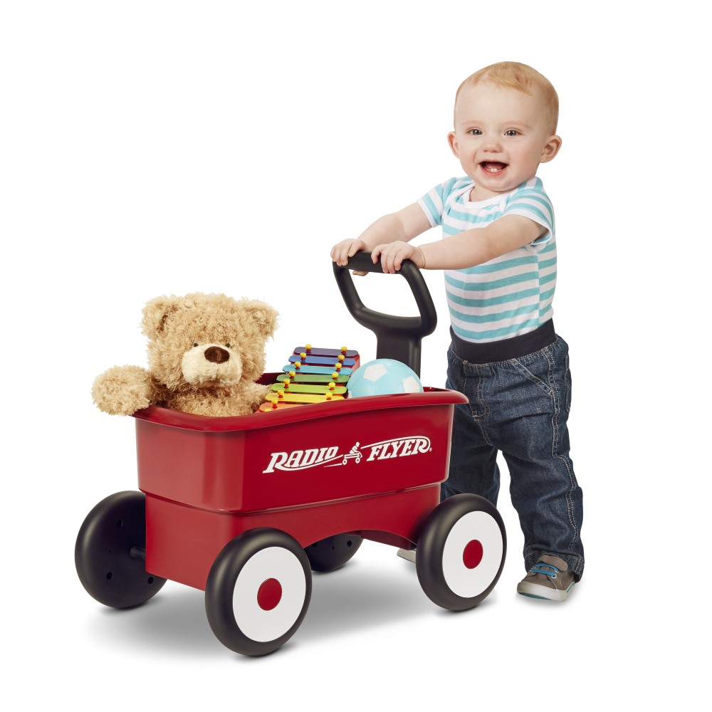 Child with push wagon toy
