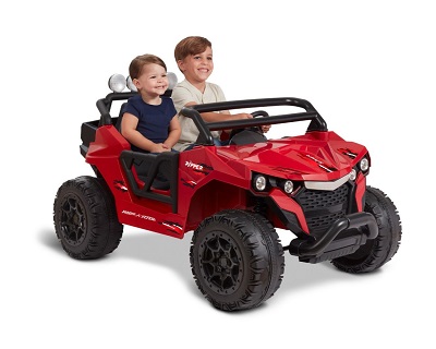 an older boy and toddler riding together on the Ripper red ride-on toy